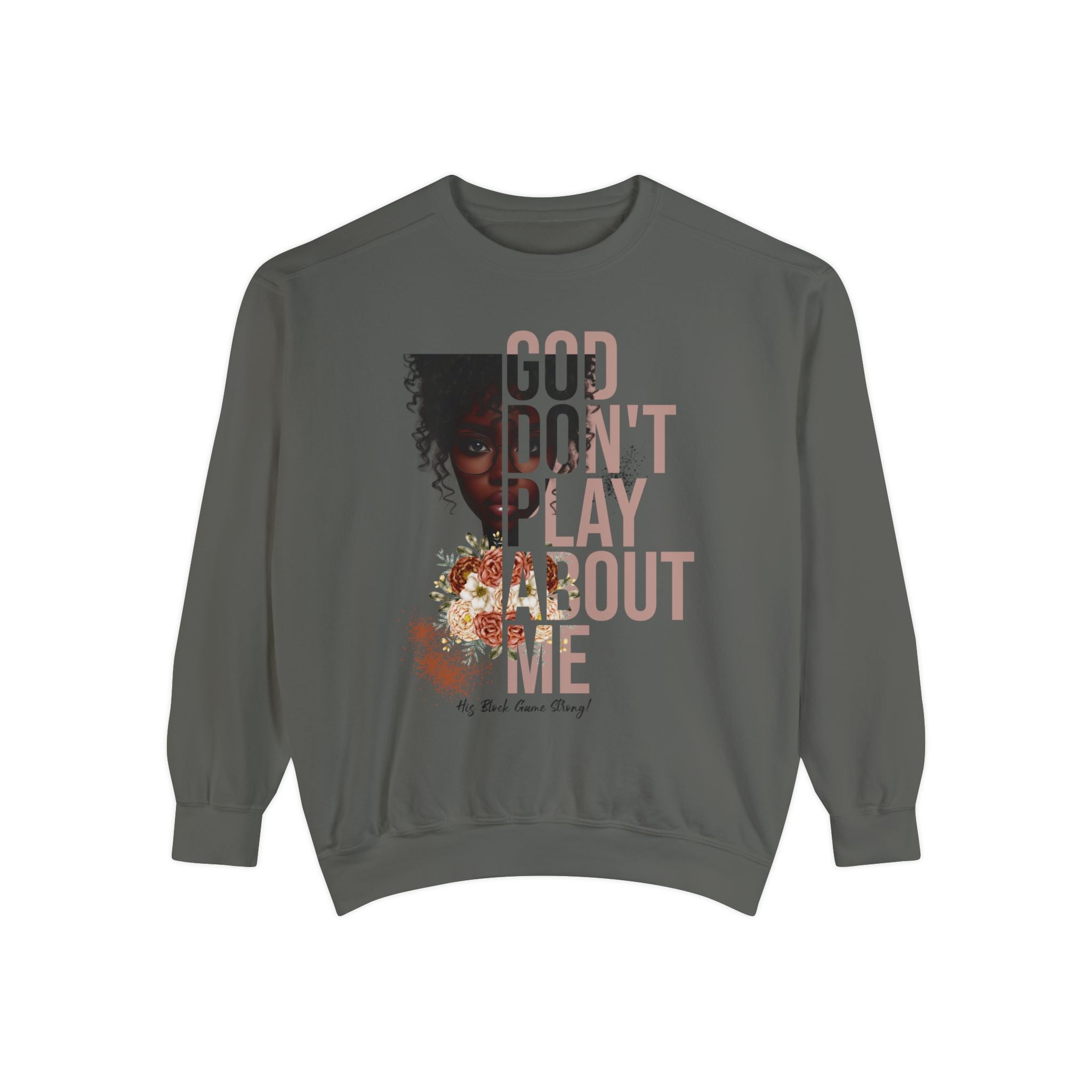 Flatlay mockup of women's pepper color sweatshirt with design that reads "God Don't Play About Me - His Block Game Strong" and dark skin lady graphic