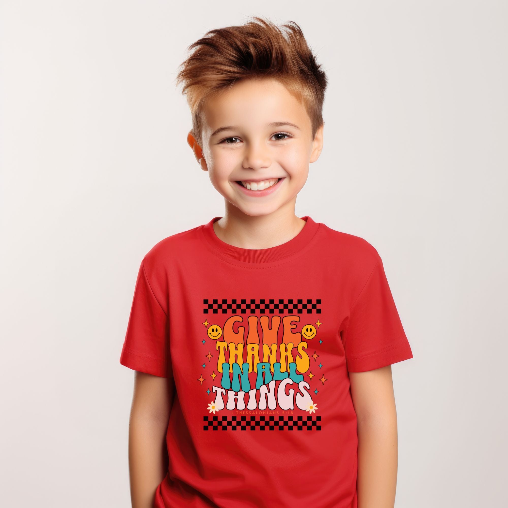 boy model wearing a red youth t-shirt with design that reads "give thanks in all things", inspired by Thessalonians 5:18