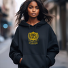 model wearing a navy hoodie with design that says '828 It's All Good' in gold embroidery, inspired by bible verse Romans 8:28